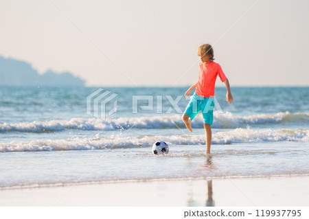 Kids playing on beach. Children play at sea. Kids playing on beach. Children play at sea. 119937795