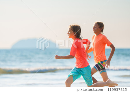 Kids playing on beach. Children play at sea. Kids playing on beach. Children play at sea. 119937815