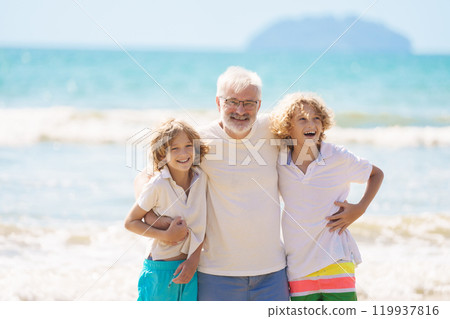 Grandfather and kids on summer beach Grandfather and kids on summer beach 119937816