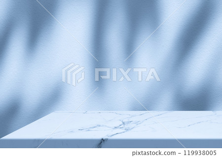 Marble Table Corner with Light Beam, Shadow, and Spotlight on the Blue Concrete Wall Background 119938005