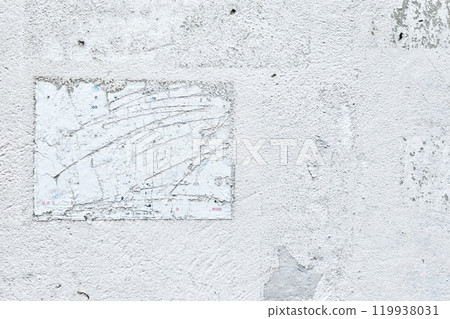 Peeling Poster left Glue Adhesive Stain on White Concrete wall. 119938031