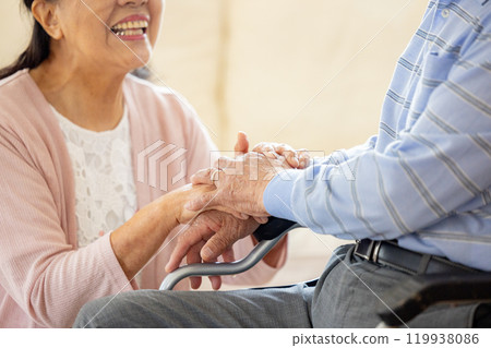 Senior couple, wheelchair, elderly care 119938086