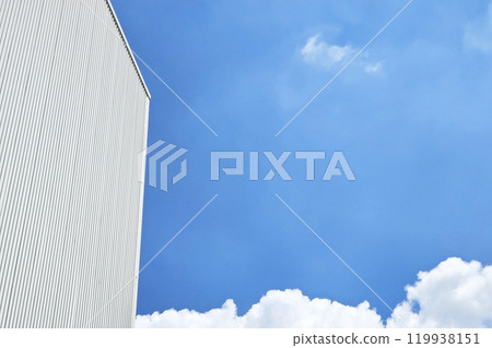 Warehouse Wall with Blue Sky Background. Warehouse Wall with Blue Sky Background. 119938151