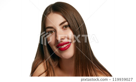 Cheerful smiling young woman with red lips posing looking at camera shows confidence against white background. Cheerful smiling young woman with red lips posing looking at camera shows confidence against white background. 119939027