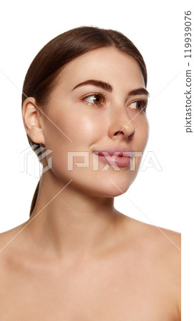 Close-up photo of pretty young brunette woman against white background. Facial asymmetry and lifting 119939076