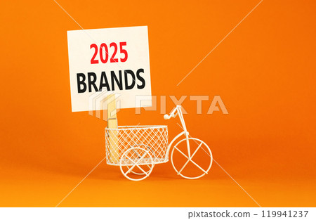 Planning 2025 brands new year symbol. Concept words 2025 Brands on beautiful white paper on wooden clothespin. Bicycle. Beautiful orange background. Business 2025 brands new year concept. Copy space. 119941237