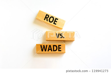 Abortion process Roe versus Wade symbol. Concept words Roe versus Wade on wooden blocks. Beautiful white table white background. Abortion process Roe versus Wade concept. Copy space. 119941273