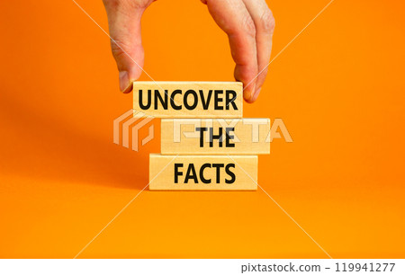 Uncover the facts symbol. Concept words Uncover the facts on wooden blocks on a beautiful orange table orange background. Businessman hand. Business and uncover the facts concept. Copy space. Uncover the facts symbol. Concept words Uncover the facts on wooden blocks on a beautiful orange table orange background. Businessman hand. Business and uncover the facts concept. Copy space. 119941277