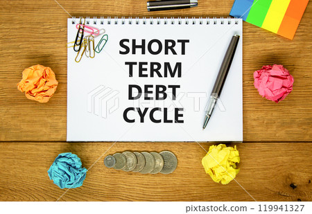 Short term debt cycle symbol. Concept words Short term debt cycle on beautiful white note. Beautiful wooden table background. Colored paper. Pen. Business Short term debt cycle concept. Copy space. Short term debt cycle symbol. Concept words Short term debt cycle on beautiful white note. Beautiful wooden table background. Colored paper. Pen. Business Short term debt cycle concept. Copy space. 119941327