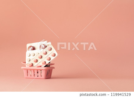 pills in blisters in a shopping cart, medicine concept, healthcare, copy space 119941529