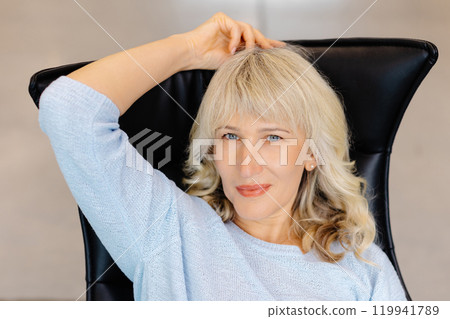 Confident Woman in Modern Office Setting Portrait Confident Woman in Modern Office Setting Portrait 119941789