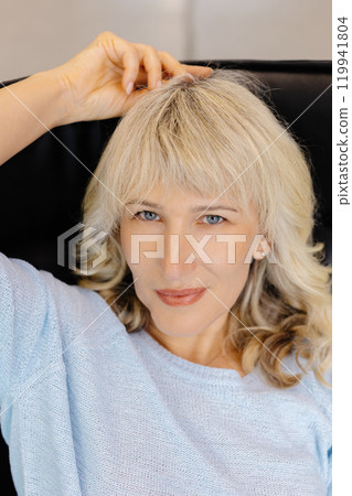 Confident Woman in Modern Office Setting Portrait Confident Woman in Modern Office Setting Portrait 119941804