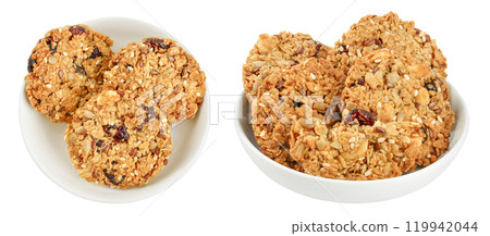Granola cookie in ceramic bowl isolated on white background with full depth of field. Top view. Flat lay. Granola cookie in ceramic bowl isolated on white background with full depth of field. Top view. Flat lay. 119942044