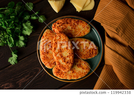 Chvishtari, corn flour tortillas with cheese, pastries, Georgian cuisine, Mchadi, homemade, top view, on a wooden table, no people, 119942338