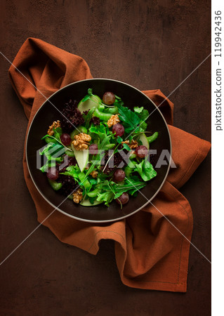 Fresh salad,waldorf. celery stalk, with apple and walnut, grapes, herbs, homemade, no people 119942436