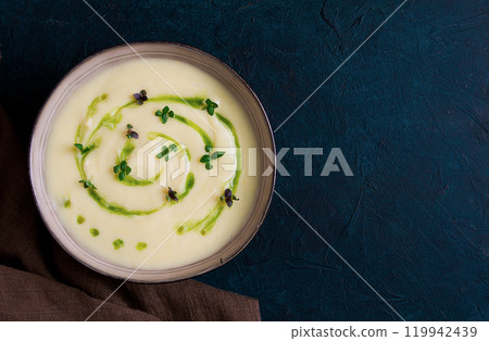 Mashed potatoes, with green butter, micro greenery, homemade, on a dark background, no people, top view, Mashed potatoes, with green butter, micro greenery, homemade, on a dark background, no people, top view, 119942439