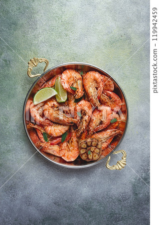 Fried king prawns, in shell, with spices, size 30/40 , unpeeled shrimp,homemade, no people, 119942459