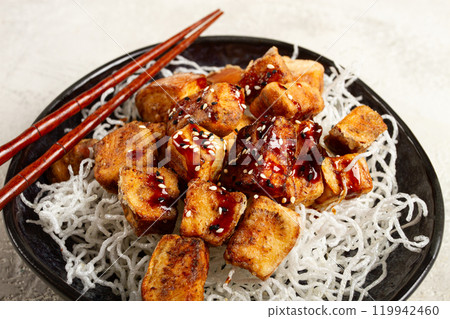 fried eggplant, with funchosa noodles, with teriyaki sauce and sesame seeds, homemade, no people 119942460