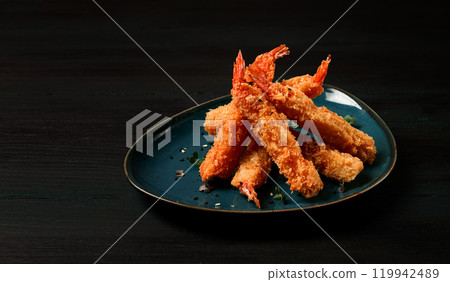 Fried shrimp, peeled in tempura, soy sauce, close-up, 119942489