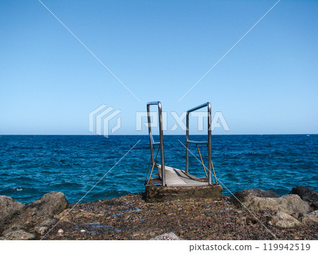 Ladder on the rock near the ocean Ladder on the rock near the ocean 119942519