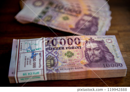 Stack of the 10000 forint banknotes. Stacks of 10000 forint notes tied with paper bands. Stack of the 10000 forint banknotes. Stacks of 10000 forint notes tied with paper bands. 119942888