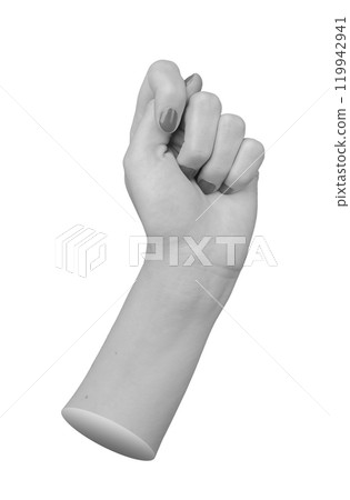 Female hand in a closed fist, thumb placed between index and middle finger, displaying the fig 119942941
