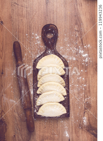 raw chebureks, mini, on a cutting board, wooden table, close-up, no people, raw chebureks, mini, on a cutting board, wooden table, close-up, no people, 119943236