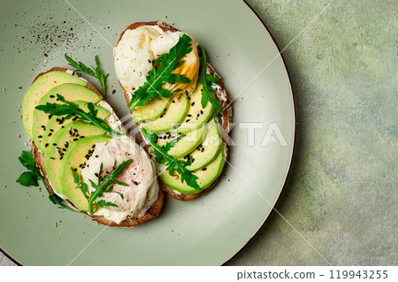 sandwich with cream cheese, sliced avocado and boiled egg, arugula, on grainy bread, homemade, breakfast, no people, 119943255