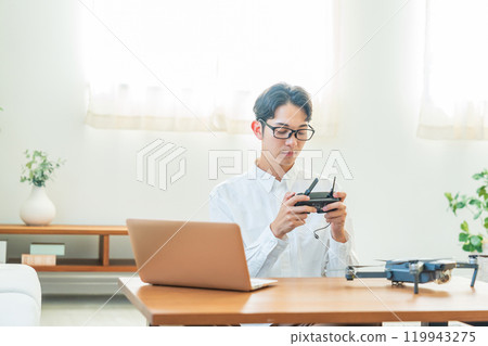 Drone, computer, young man 119943275