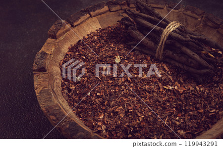 Madder dye, Endro, rhizome for coloring eggs, powder from the roots of endro with onion husks, in a wooden plate, top view, Easter, Georgia, Madder dye, Endro, rhizome for coloring eggs, powder from the roots of endro with onion husks, in a wooden plate, top view, Easter, Georgia, 119943291