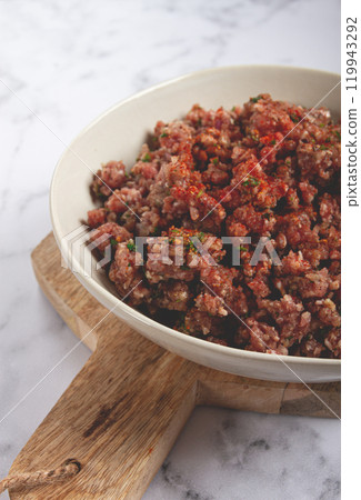 raw minced meat, marinated with spices and herbs, in a bowl, minced meat with spices, top view, homemade, no people, raw minced meat, marinated with spices and herbs, in a bowl, minced meat with spices, top view, homemade, no people, 119943292