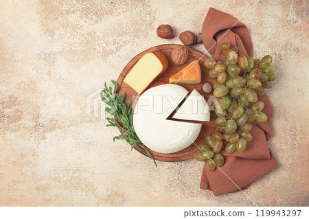 Georgian cheese, Imeretian and smoked suluguni, grapes, nuts, on a cutting board, Georgian cuisine, no people, Georgian cheese, Imeretian and smoked suluguni, grapes, nuts, on a cutting board, Georgian cuisine, no people, 119943297