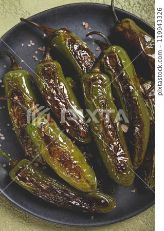 fried padron pepper, in a frying pan, with olive oil, and sea salt, homemade, no people. 119943326