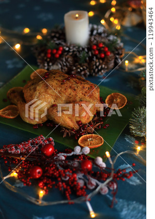 a beautifully roasted turkey, perfectly golden and glistening, presented on a festive holiday table for Christmas Eve a beautifully roasted turkey, perfectly golden and glistening, presented on a festive holiday table for Christmas Eve 119943464