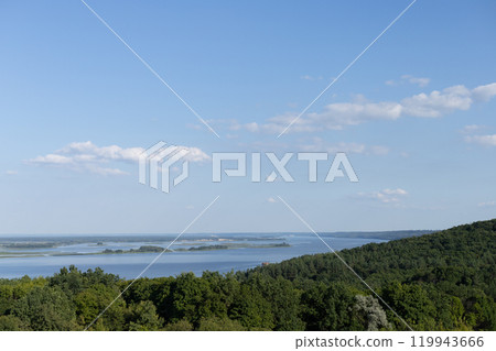 landscape, green trees on a background of blue sky and water landscape, green trees on a background of blue sky and water 119943666