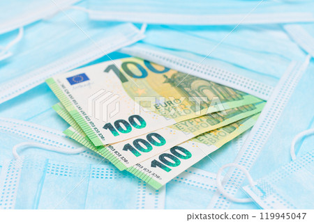 Euro Banknotes with Blue Disposable Medical Face Masks Euro Banknotes with Blue Disposable Medical Face Masks 119945047