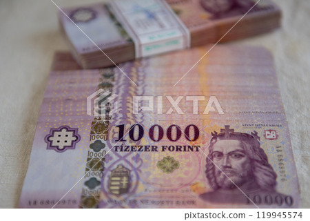 Stack of the 10000 forint banknotes. Stacks of 10000 forint notes tied with paper bands. 119945574
