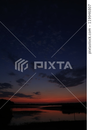 Morning glow reflected on the water surface Morning glow reflected on the water surface 119946807