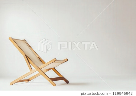 The wooden deck chair stands alone in a minimalist environment, its clean lines and natural materials creating an inviting atmosphere perfect for relaxation. 119946942