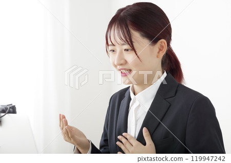 Woman having an online interview Woman having an online interview 119947242