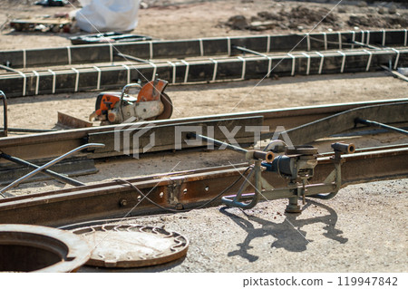 Welding streetcar rails during street repairs in city. Timely replacement of worn-out tramway rails. Welding streetcar rails during street repairs in city. Timely replacement of worn-out tramway rails. 119947842