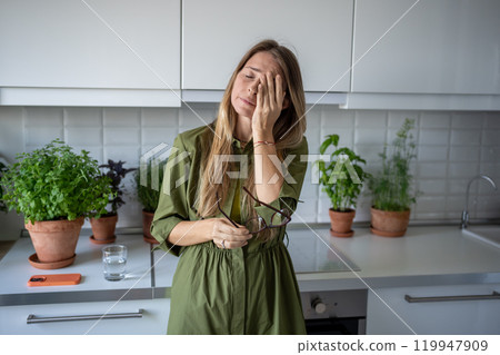 Tired sad woman rubbing eyes. Girl depressed, stressed, feels weary, upset, trapped, exhausted  119947909