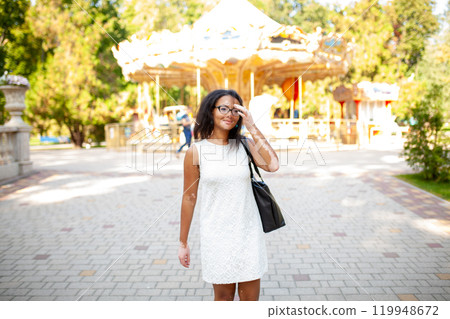 Thoughtful woman with vitiligo skin issue standing Thoughtful woman with vitiligo skin issue standing 119948672