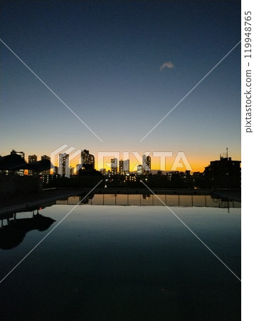 Outdoor pool evening view Outdoor pool evening view 119948765