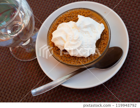 Most popular dessert is coffee and cream. French mousse in glass cup 119948792