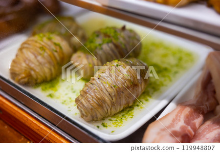 Uncooked madejas aragones on counter in cafe Uncooked madejas aragones on counter in cafe 119948807