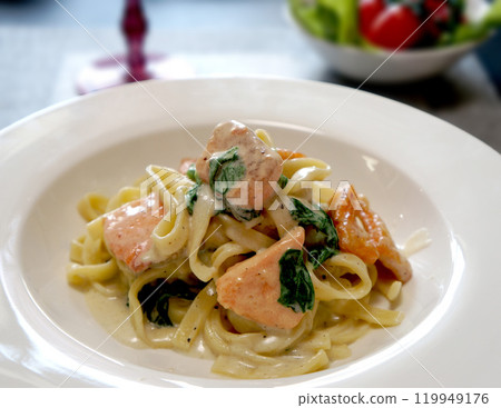 Salmon and spinach pasta 119949176