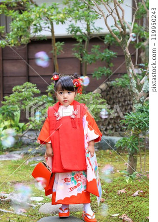 Cute three-year-old girl at Shichigosan shrine visit, location photoshoot at shrine/temple, family photo with kimono and kids in haori Cute three-year-old girl at Shichigosan shrine visit, location photoshoot at shrine/temple, family photo with kimono and kids in haori 119950243