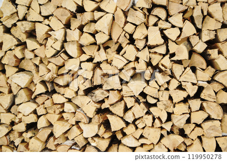 Texture and background of the firewood is neatly stacked. Firewood made of natural wood is laid and prepared for the winter. 119950278