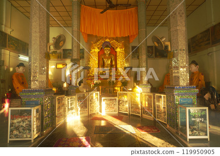 Shwe Myethman Buddha wears glasses. At Shwe Myethman Temple, Located at Shwedaung city in Myanmar. 119950905
